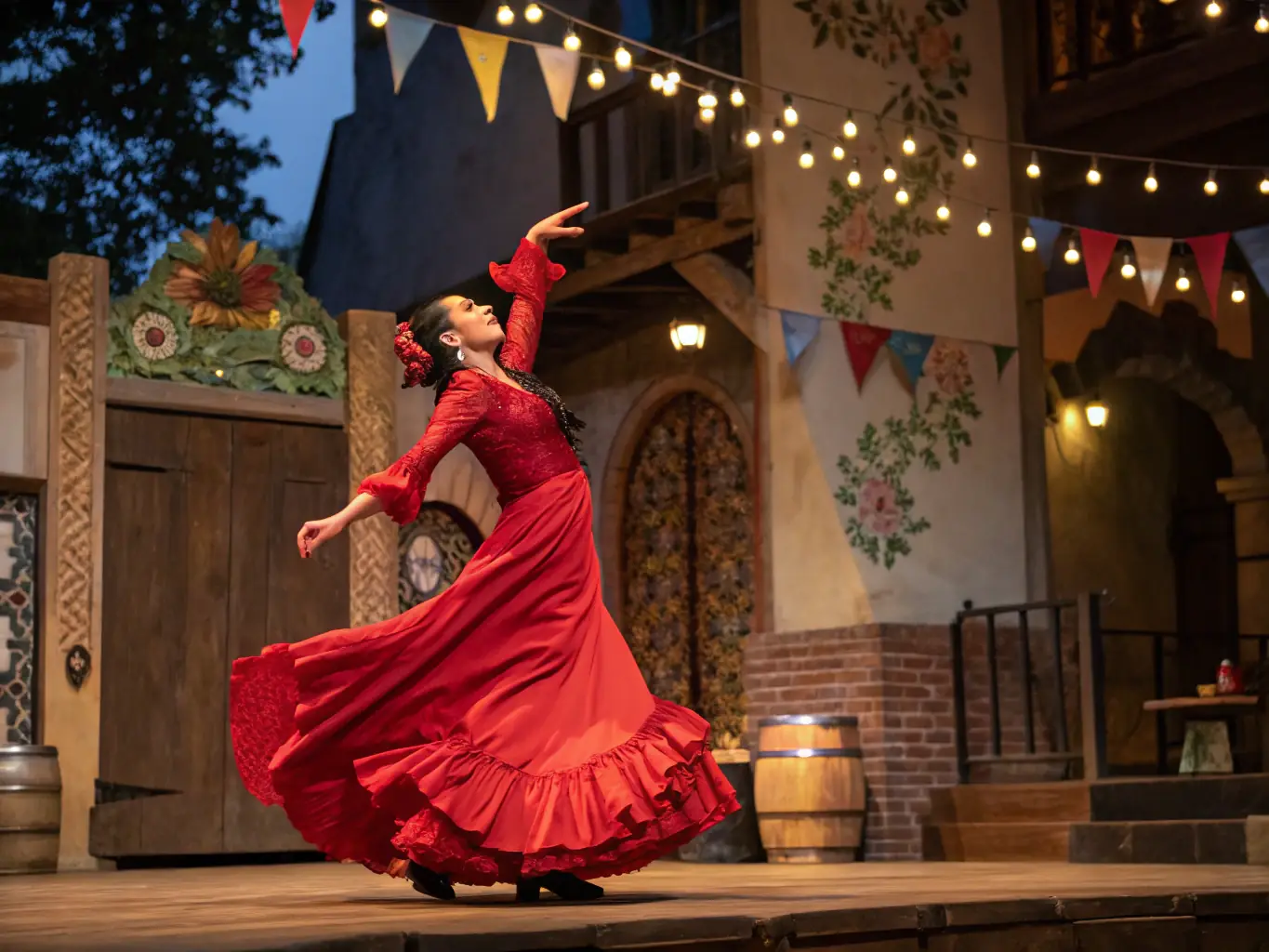 A flamenco dancer using castanets to create rhythmic patterns during a performance.